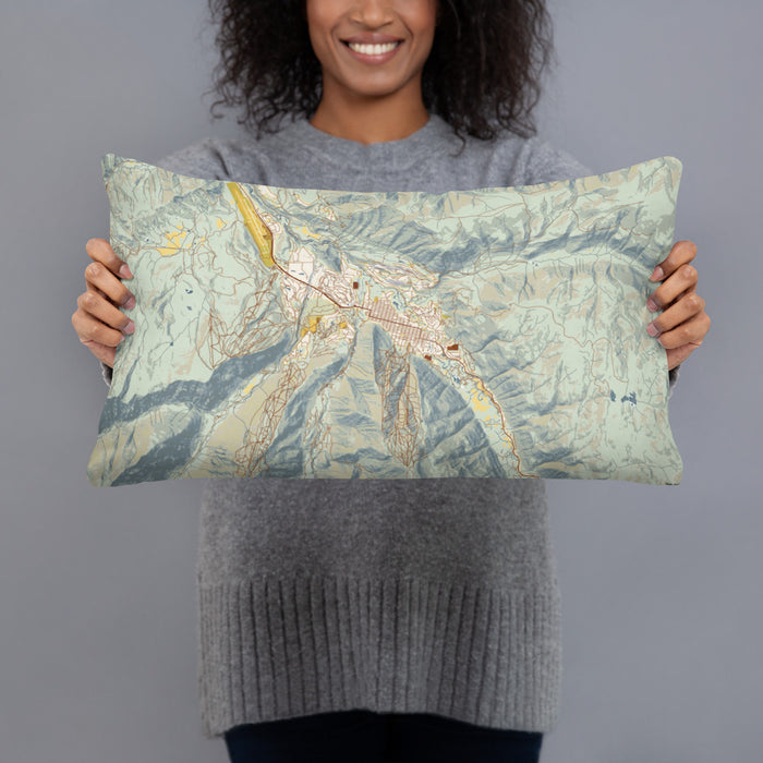 Person holding 20x12 Custom Aspen Colorado Map Throw Pillow in Woodblock