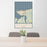 24x36 Astoria Oregon Map Print Portrait Orientation in Woodblock Style Behind 2 Chairs Table and Potted Plant