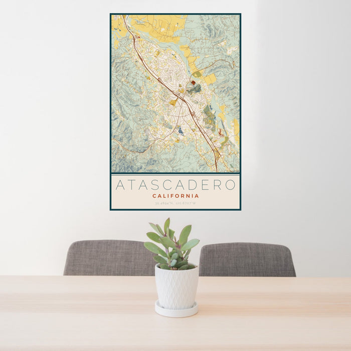 24x36 Atascadero California Map Print Portrait Orientation in Woodblock Style Behind 2 Chairs Table and Potted Plant