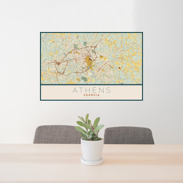 24x36 Athens Georgia Map Print Landscape Orientation in Woodblock Style Behind 2 Chairs Table and Potted Plant