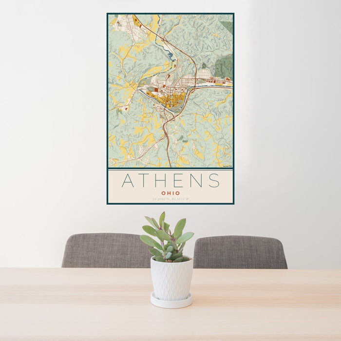 24x36 Athens Ohio Map Print Portrait Orientation in Woodblock Style Behind 2 Chairs Table and Potted Plant