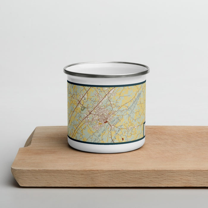 Front View Custom Athens Tennessee Map Enamel Mug in Woodblock on Cutting Board