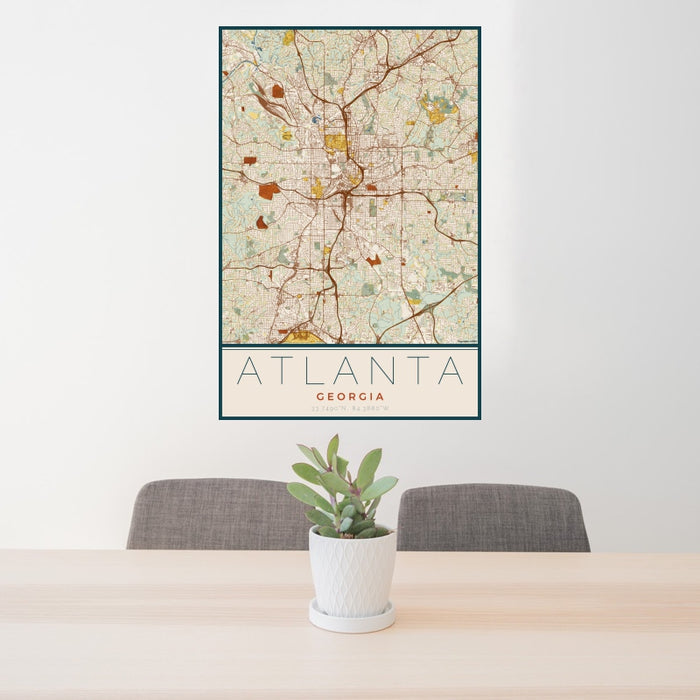 24x36 Atlanta Georgia Map Print Portrait Orientation in Woodblock Style Behind 2 Chairs Table and Potted Plant