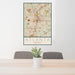 24x36 Atlanta Georgia Map Print Portrait Orientation in Woodblock Style Behind 2 Chairs Table and Potted Plant