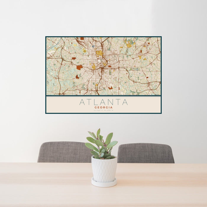 24x36 Atlanta Georgia Map Print Landscape Orientation in Woodblock Style Behind 2 Chairs Table and Potted Plant