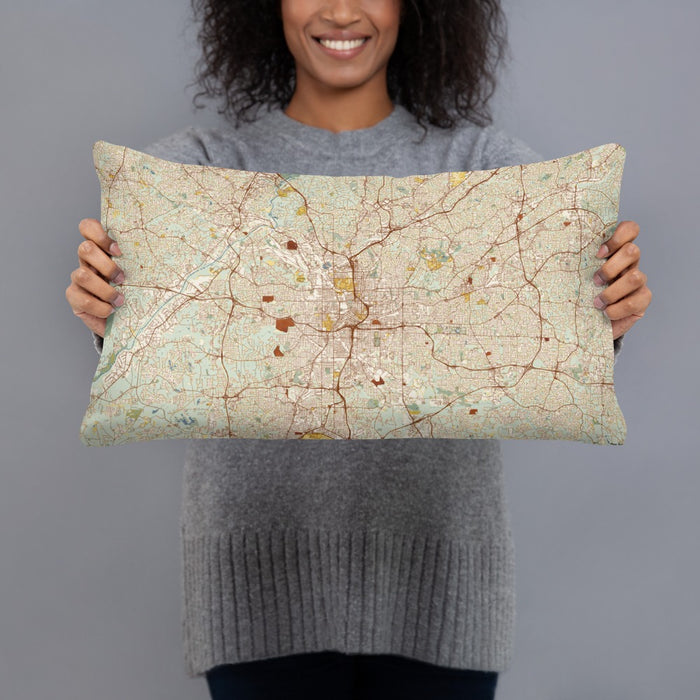 Person holding 20x12 Custom Atlanta Georgia Map Throw Pillow in Woodblock
