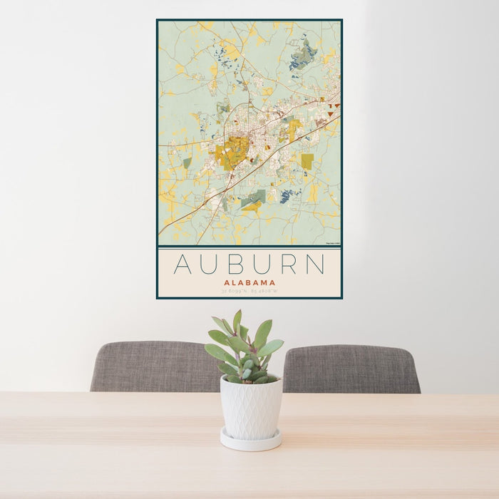 24x36 Auburn Alabama Map Print Portrait Orientation in Woodblock Style Behind 2 Chairs Table and Potted Plant
