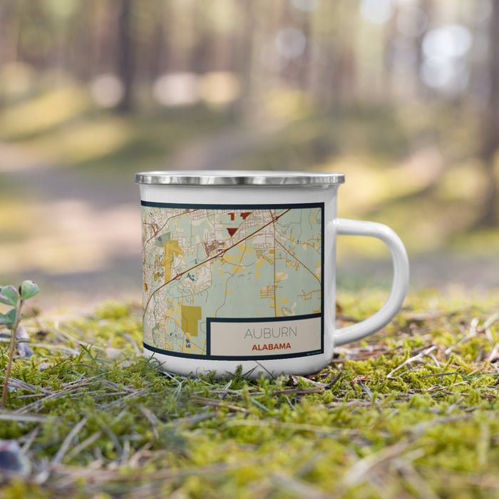 Right View Custom Auburn Alabama Map Enamel Mug in Woodblock on Grass With Trees in Background