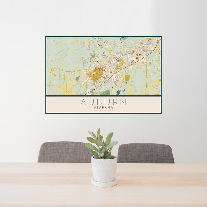 24x36 Auburn Alabama Map Print Landscape Orientation in Woodblock Style Behind 2 Chairs Table and Potted Plant