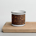 Front View Custom Aurora Colorado Map Enamel Mug in Ember on Cutting Board