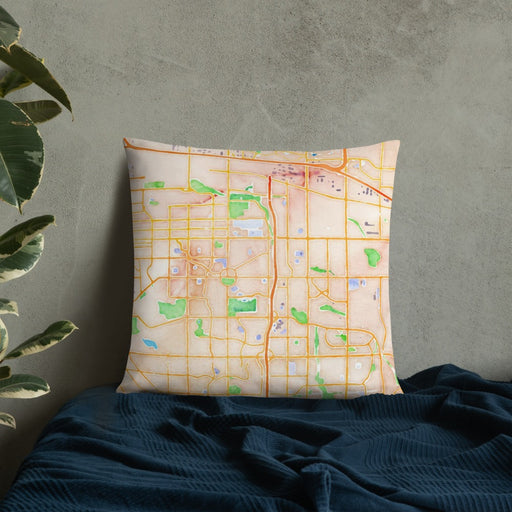 Custom Aurora Colorado Map Throw Pillow in Watercolor on Bedding Against Wall