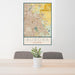 24x36 Aurora Colorado Map Print Portrait Orientation in Woodblock Style Behind 2 Chairs Table and Potted Plant