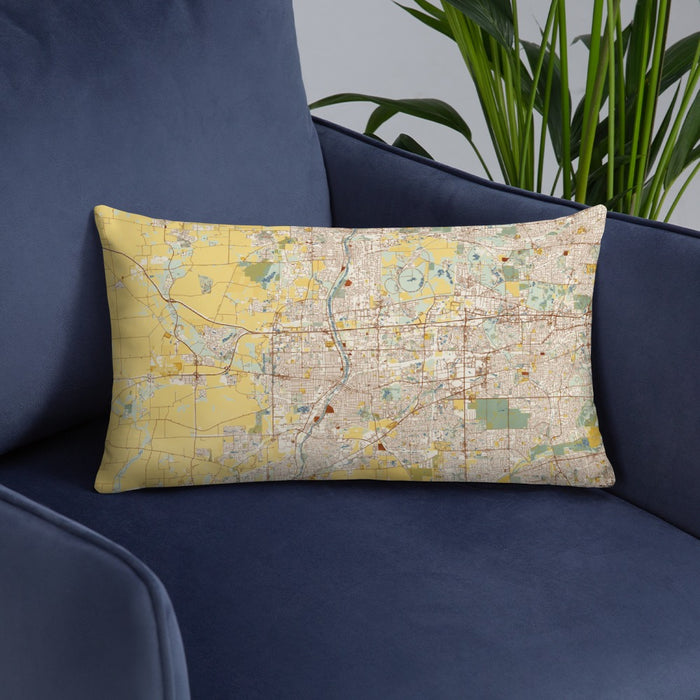 Custom Aurora Illinois Map Throw Pillow in Woodblock on Blue Colored Chair