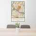 24x36 Austin Texas Map Print Portrait Orientation in Woodblock Style Behind 2 Chairs Table and Potted Plant