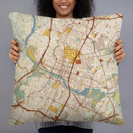 Person holding 22x22 Custom Austin Texas Map Throw Pillow in Woodblock