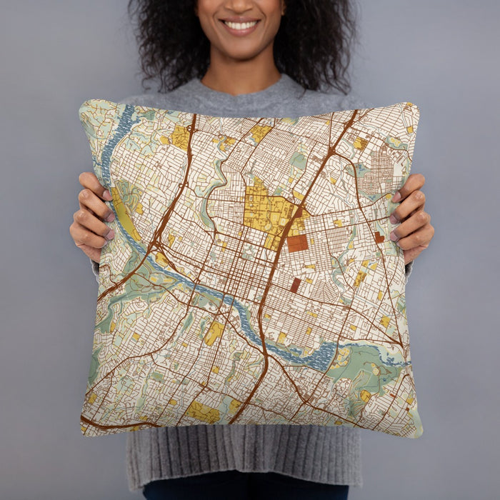 Person holding 18x18 Custom Austin Texas Map Throw Pillow in Woodblock
