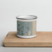 Front View Custom Aventura Florida Map Enamel Mug in Afternoon on Cutting Board