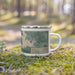 Right View Custom Azle Texas Map Enamel Mug in Afternoon on Grass With Trees in Background