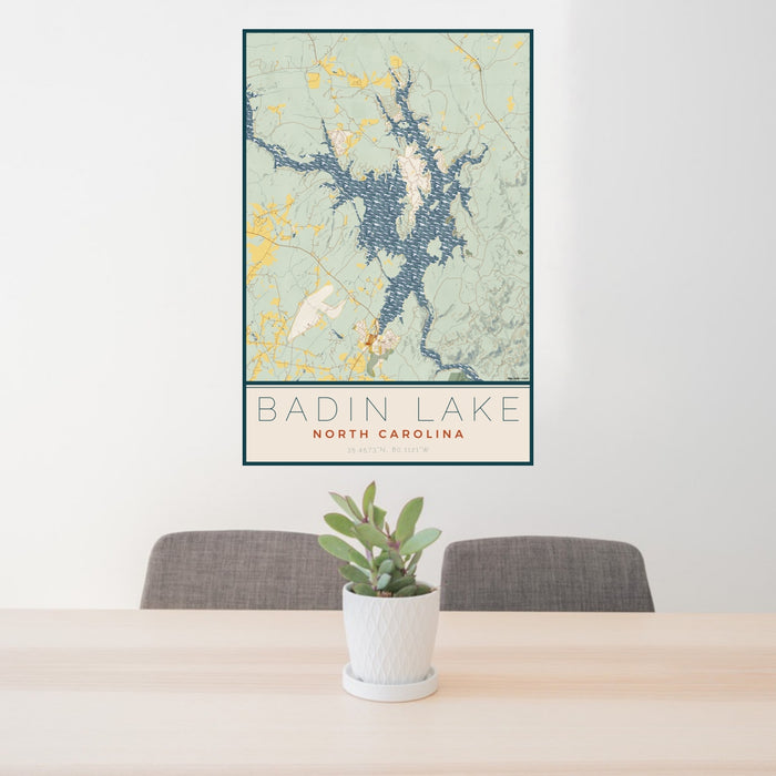 24x36 Badin Lake North Carolina Map Print Portrait Orientation in Woodblock Style Behind 2 Chairs Table and Potted Plant