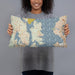 Person holding 20x12 Custom Bainbridge Island Washington Map Throw Pillow in Woodblock