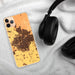 Custom Bakersfield California Map Phone Case in Ember on Table with Black Headphones