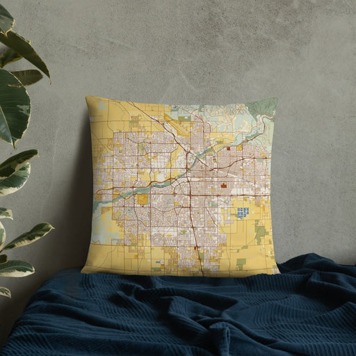 Custom Bakersfield California Map Throw Pillow in Woodblock on Bedding Against Wall