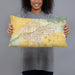 Person holding 20x12 Custom Bakersfield California Map Throw Pillow in Woodblock