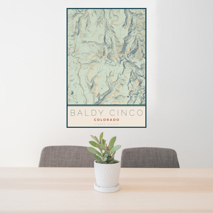 24x36 Baldy Cinco Colorado Map Print Portrait Orientation in Woodblock Style Behind 2 Chairs Table and Potted Plant