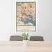 24x36 Baltimore Maryland Map Print Portrait Orientation in Woodblock Style Behind 2 Chairs Table and Potted Plant