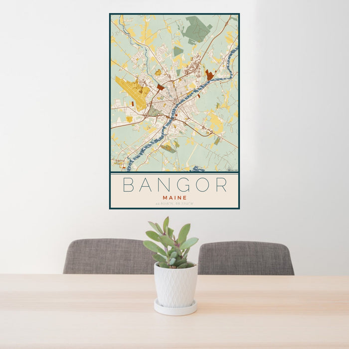 24x36 Bangor Maine Map Print Portrait Orientation in Woodblock Style Behind 2 Chairs Table and Potted Plant