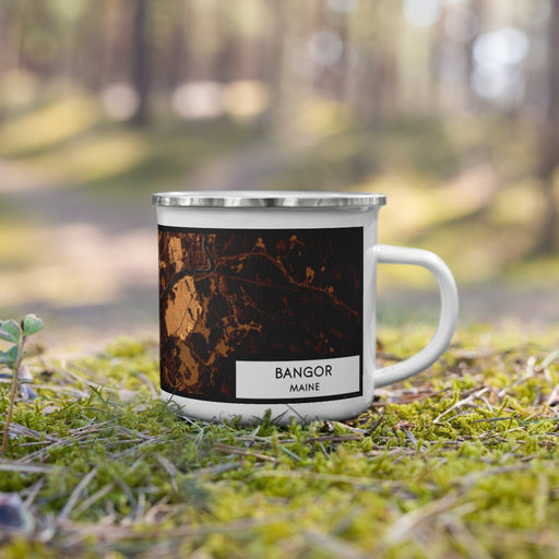 Right View Custom Bangor Maine Map Enamel Mug in Ember on Grass With Trees in Background