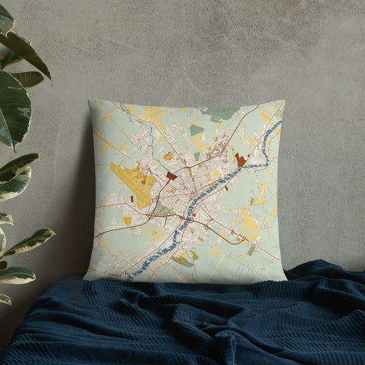 Custom Bangor Maine Map Throw Pillow in Woodblock on Bedding Against Wall