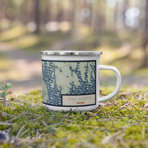 Right View Custom Bar Harbor Maine Map Enamel Mug in Woodblock on Grass With Trees in Background
