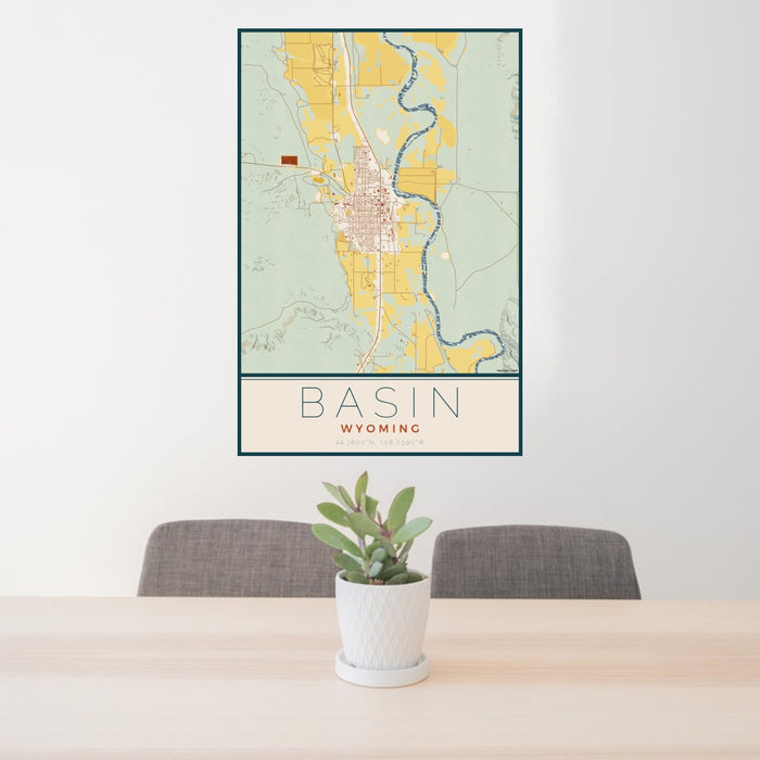 24x36 Basin Wyoming Map Print Portrait Orientation in Woodblock Style Behind 2 Chairs Table and Potted Plant