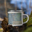 Right View Custom Basin Wyoming Map Enamel Mug in Afternoon on Grass With Trees in Background