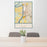 24x36 Baton Rouge Louisiana Map Print Portrait Orientation in Woodblock Style Behind 2 Chairs Table and Potted Plant