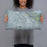Person holding 20x12 Custom Battle Mountain Nevada Map Throw Pillow in Afternoon