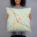 Person holding 18x18 Custom Battle Mountain Nevada Map Throw Pillow in Woodblock