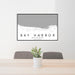 24x36 Bay Harbor Michigan Map Print Lanscape Orientation in Classic Style Behind 2 Chairs Table and Potted Plant