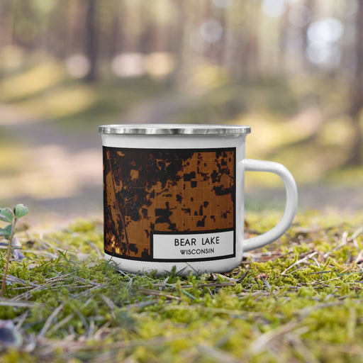 Right View Custom Bear Lake Wisconsin Map Enamel Mug in Ember on Grass With Trees in Background