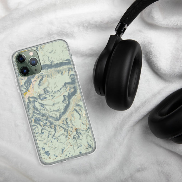 Custom Beartooth Pass Montana Map Phone Case in Woodblock on Table with Black Headphones