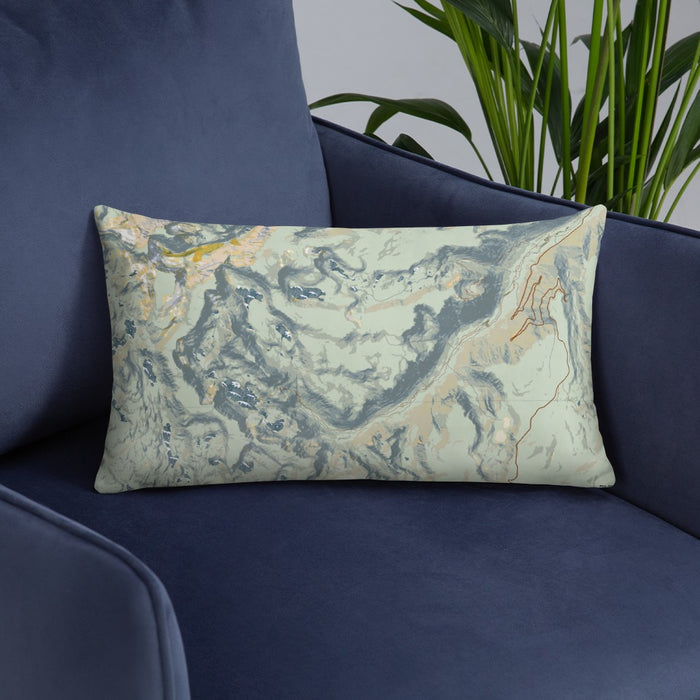 Custom Beartooth Pass Montana Map Throw Pillow in Woodblock on Blue Colored Chair