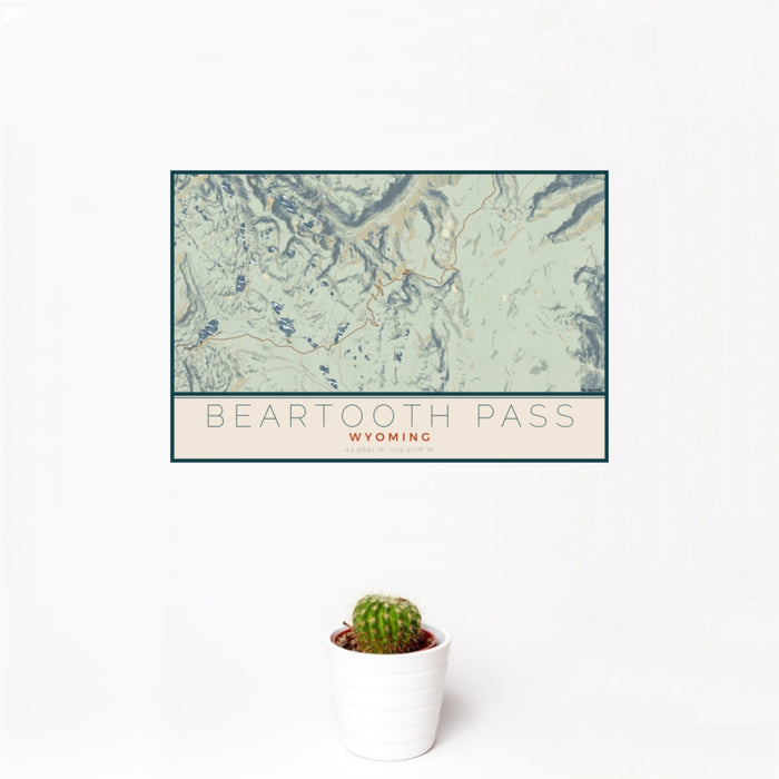 12x18 Beartooth Pass Wyoming Map Print Landscape Orientation in Woodblock Style With Small Cactus Plant in White Planter