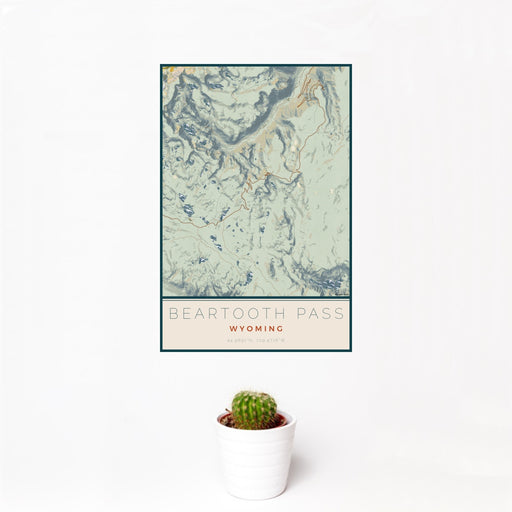 12x18 Beartooth Pass Wyoming Map Print Portrait Orientation in Woodblock Style With Small Cactus Plant in White Planter