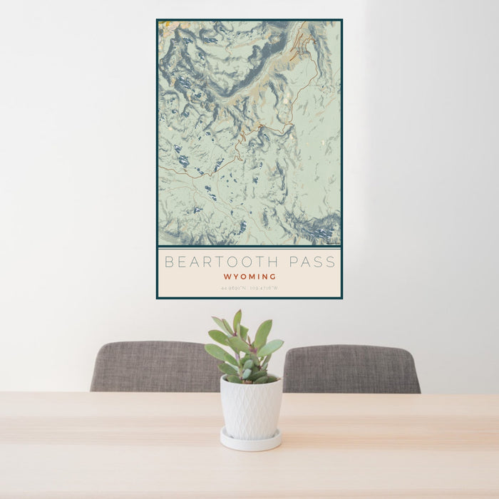24x36 Beartooth Pass Wyoming Map Print Portrait Orientation in Woodblock Style Behind 2 Chairs Table and Potted Plant