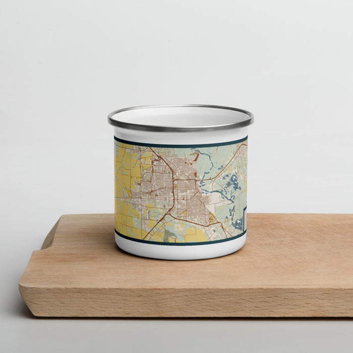 Front View Custom Beaumont Texas Map Enamel Mug in Woodblock on Cutting Board