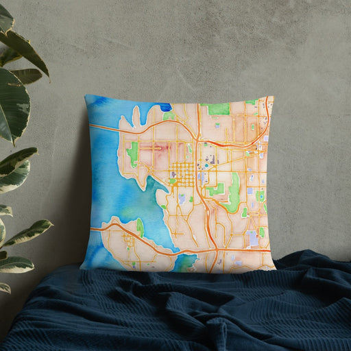 Custom Bellevue Washington Map Throw Pillow in Watercolor on Bedding Against Wall