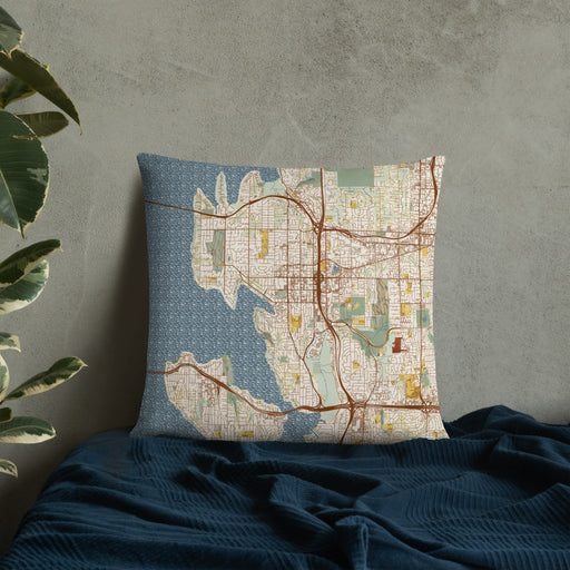 Custom Bellevue Washington Map Throw Pillow in Woodblock on Bedding Against Wall