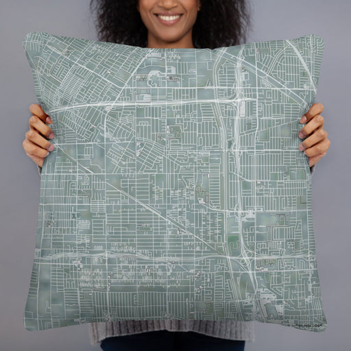 Person holding 22x22 Custom Bellflower California Map Throw Pillow in Afternoon