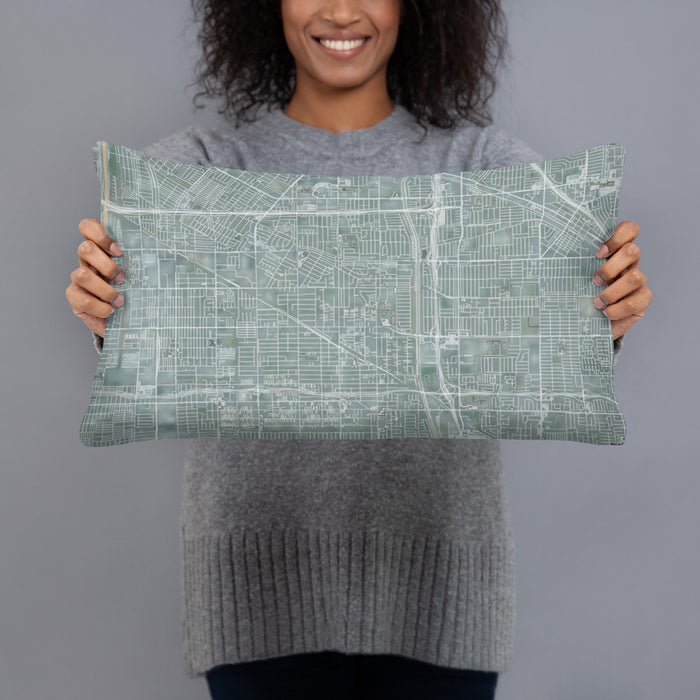 Person holding 20x12 Custom Bellflower California Map Throw Pillow in Afternoon